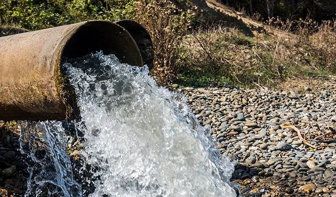 Wastewater discharge pipe into a natural stream
